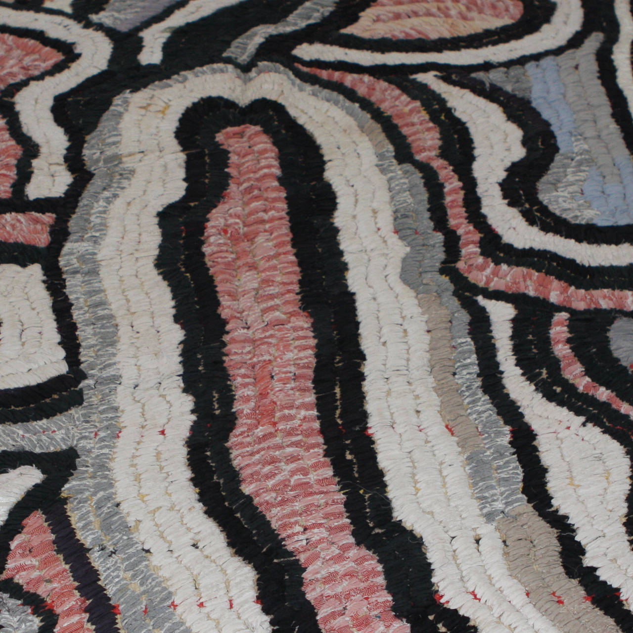 Contemporary Moroccan hand-woven rug utilizing cotton remnants in a loop technique. Highly unique and original organic pattern, very painterly. Dominant colors are grey, cream, pale pink and black.