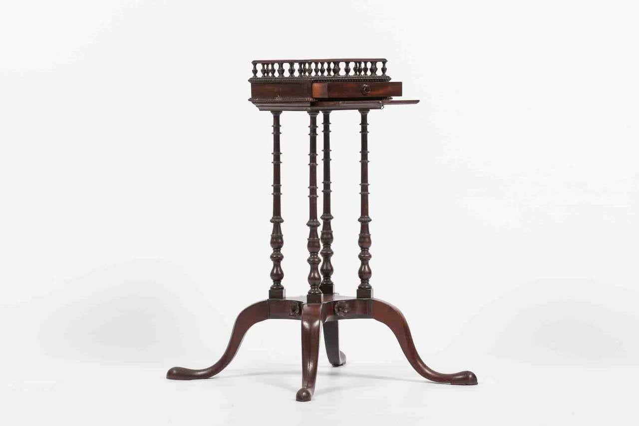 18th century George II Chippendale kettle stand, the pierced galleried top raised above drawer supported four turned legs terminating on splayed feet, circa 1740.