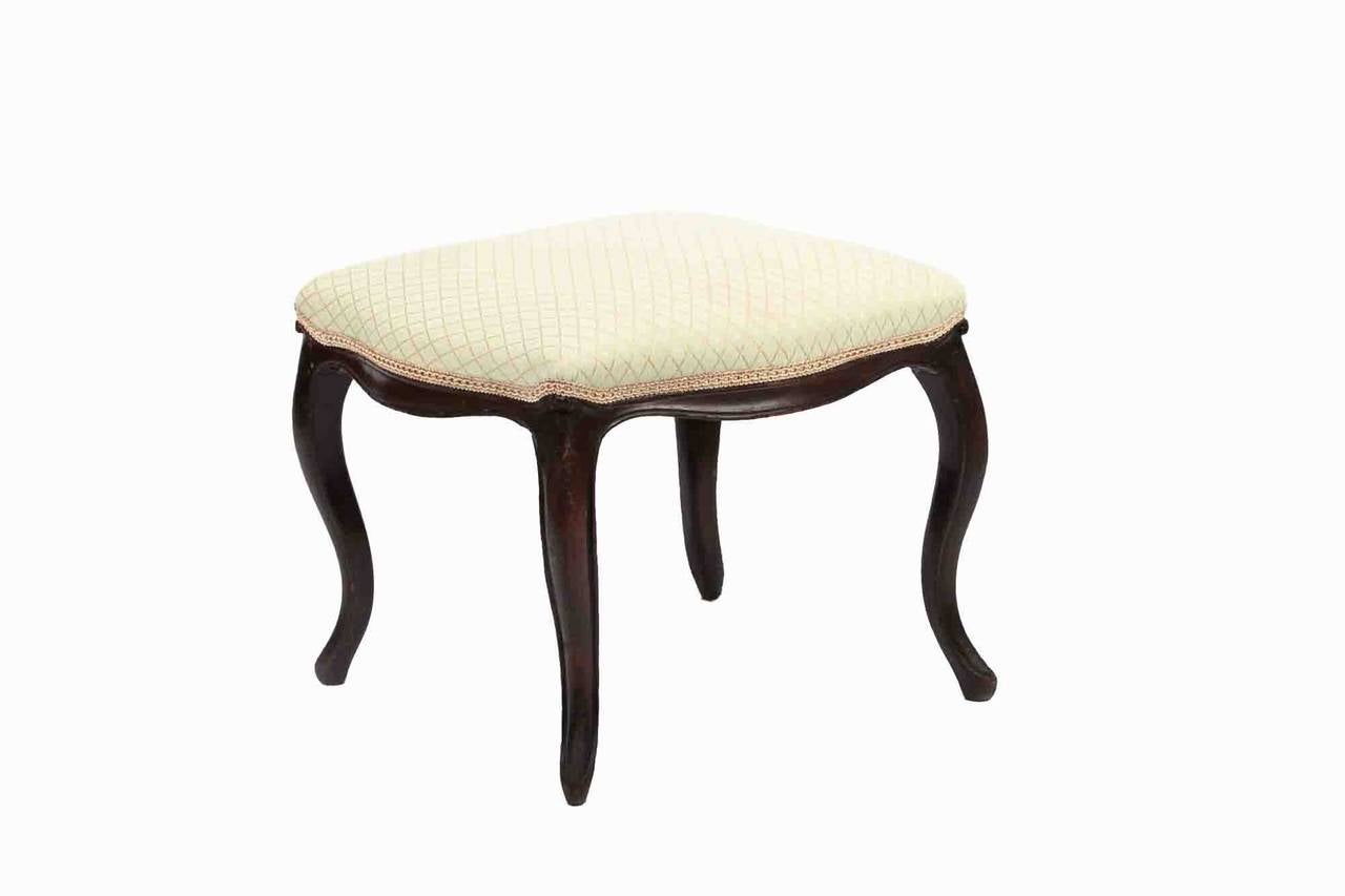19th Century mahogany stool, the shaped top on shaped seat frame raised on slender cabriole legs