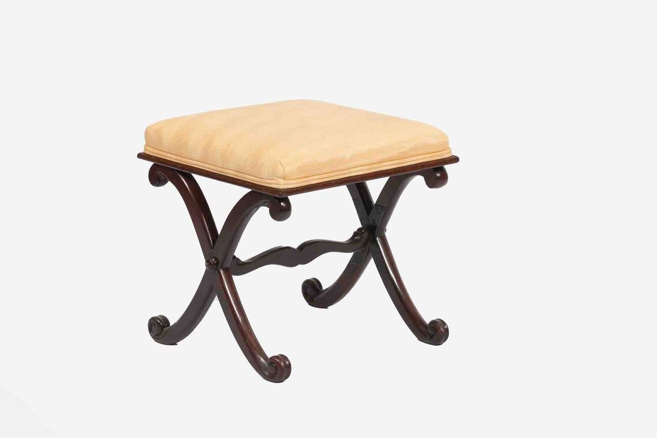 19th Century mahogany X frame stool with comfortable upholstered seat, scrolling supports and shaped stretchers