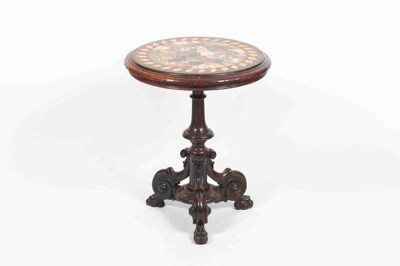 19th Century William IV marble specimen table. The marble top set within carved mahogany and raised on a fluted turned pod with carved scrolls, circa 1835.