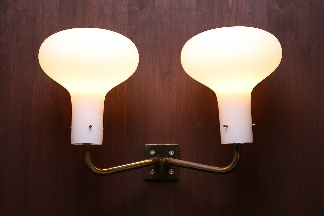 Three large-scale glass and brass sconces designed by Ignazio Gardella for Azucena. Signed, circa 1959.

Very rare objects in excellent condition.