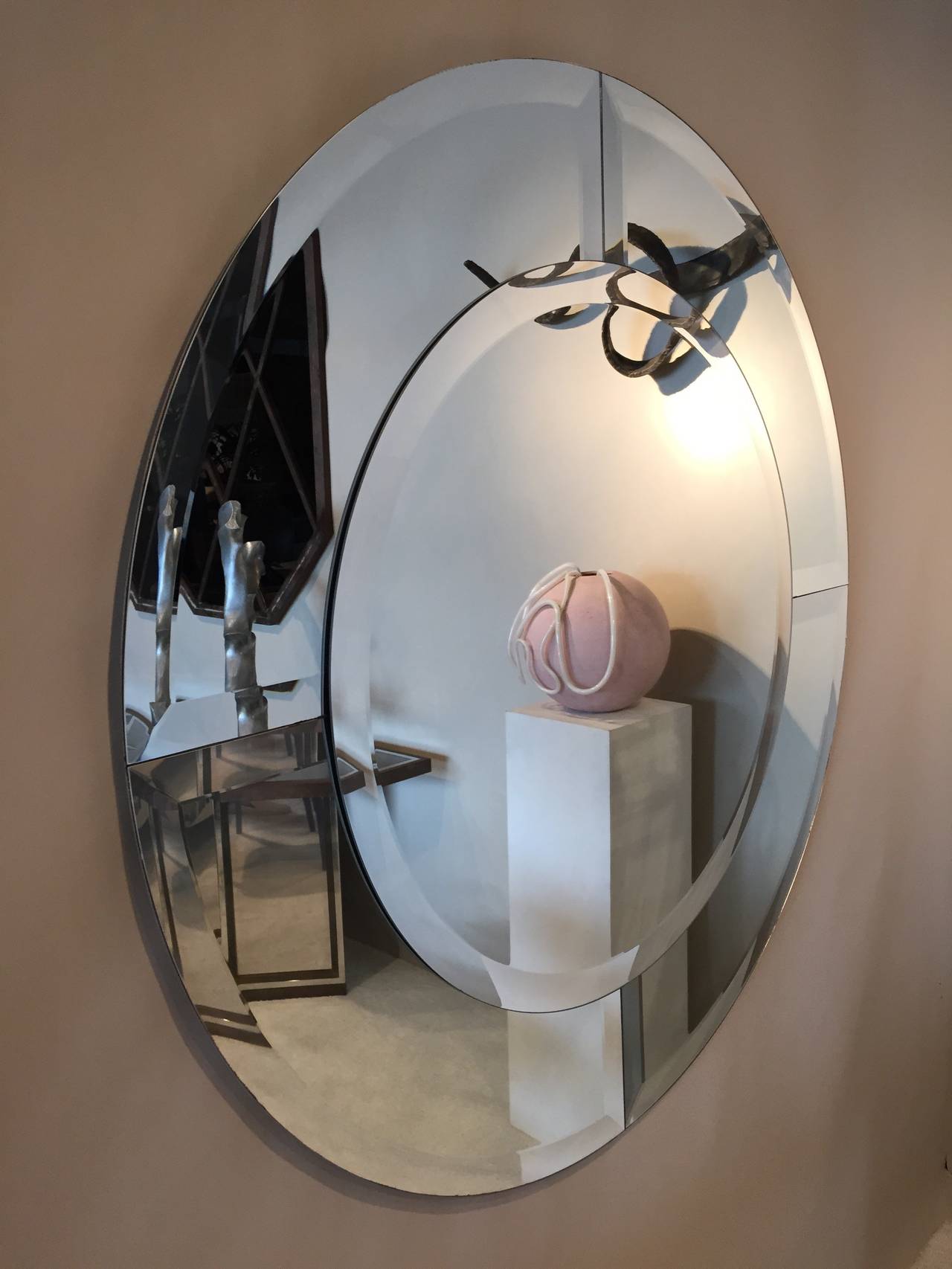 Mirror with large bevel around edges by Charles Hollis Jones.