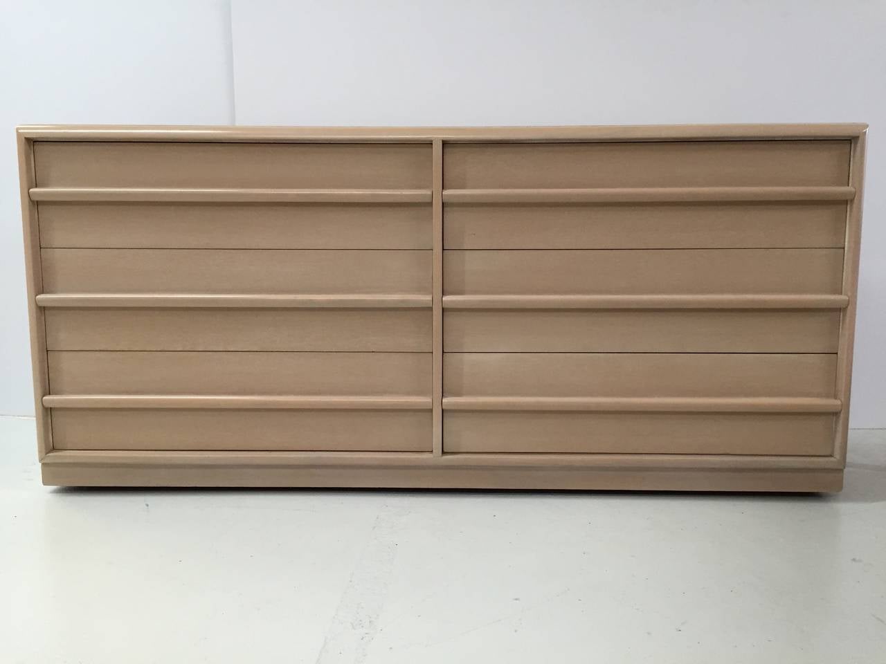 Dresser of drawers in bleached walnut by T.H. Robsjohn-Gibbings for Widdicomb.