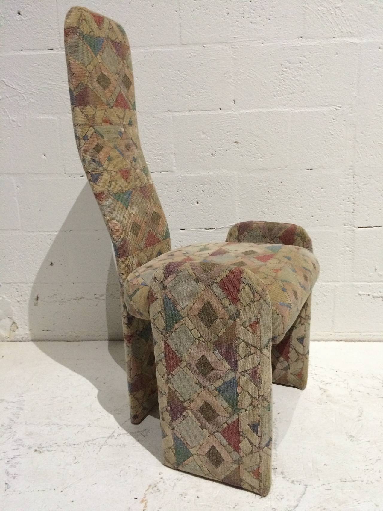 Set of six high-back dining chairs in original geometric vintage fabric over a metal frame. Two dining chairs have armrests as seen in the last photo.