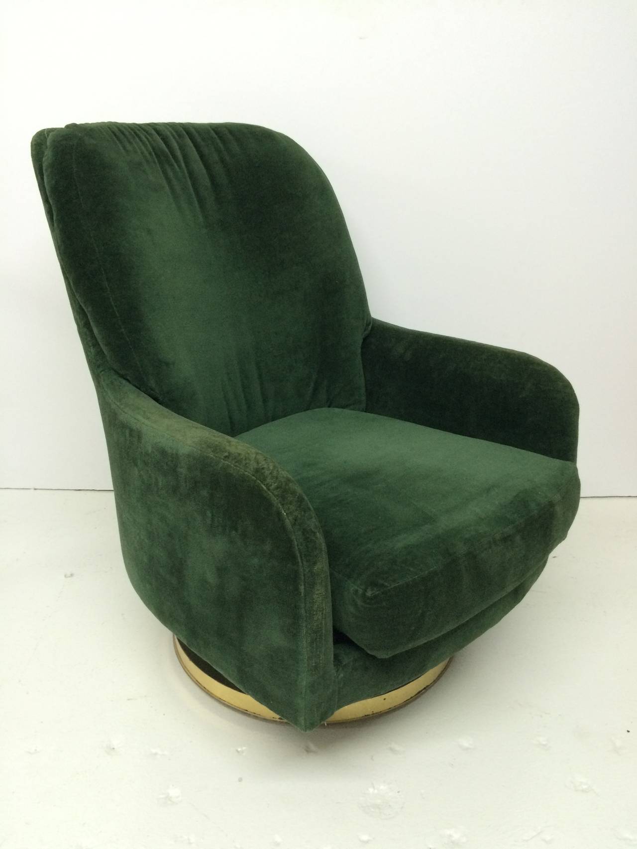 Swivel lounge chair with original green velvet fabric and round brass base by Milo Baughman for Thayer Coggin.