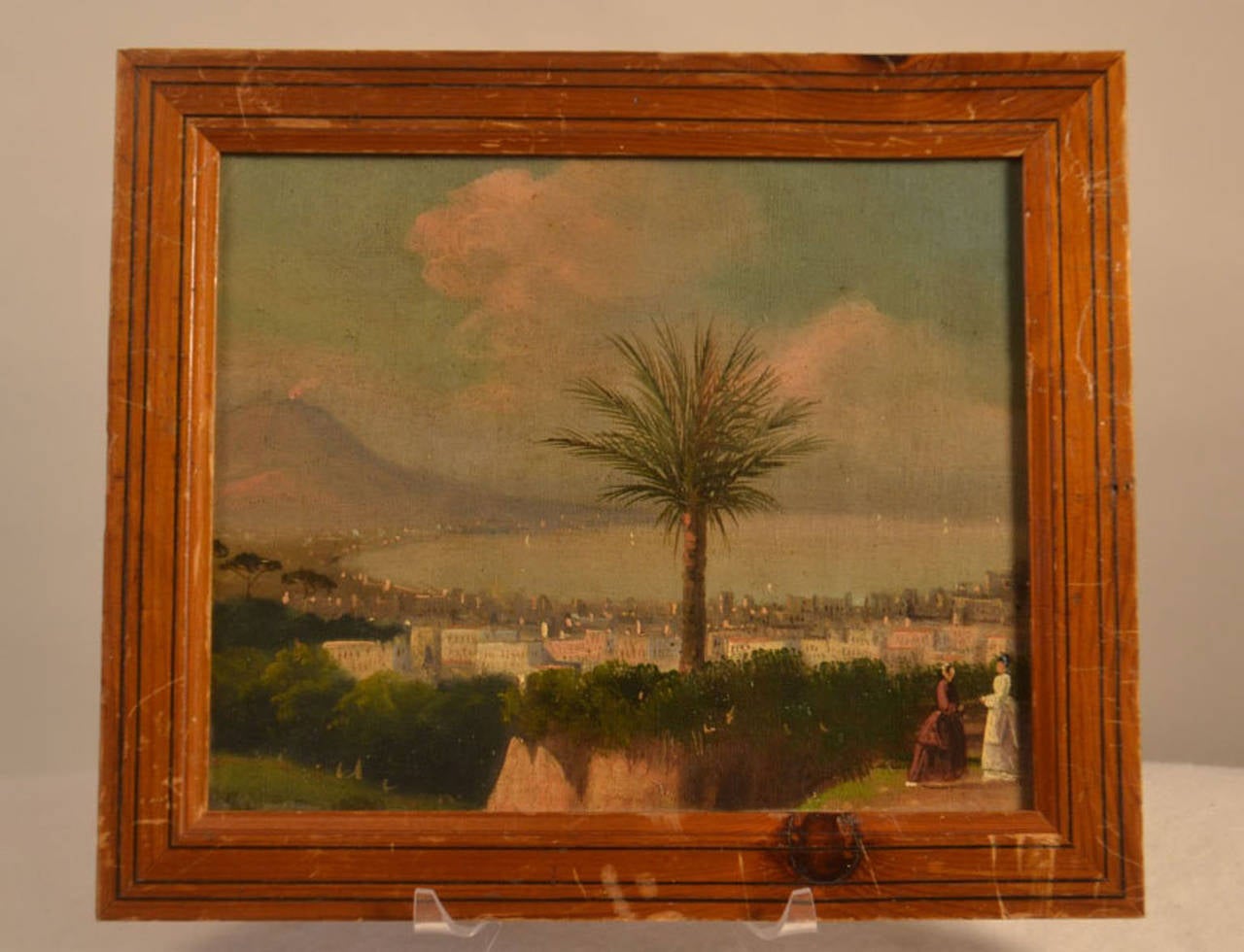 Small framed oil painting of naples. There is no signature found. There are scratches on the painting's frame. (See picture.)