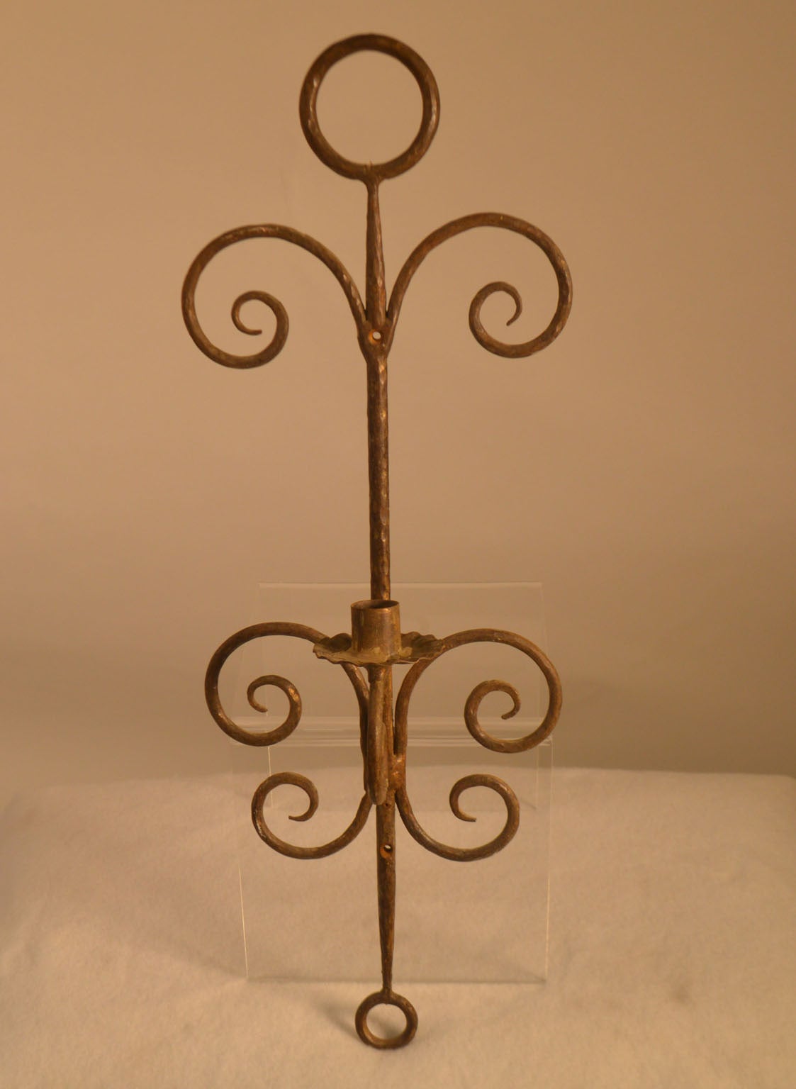 Pair of wrought iron sconces with one arm. Three sets of two sconces available. $650.00 per set of two.