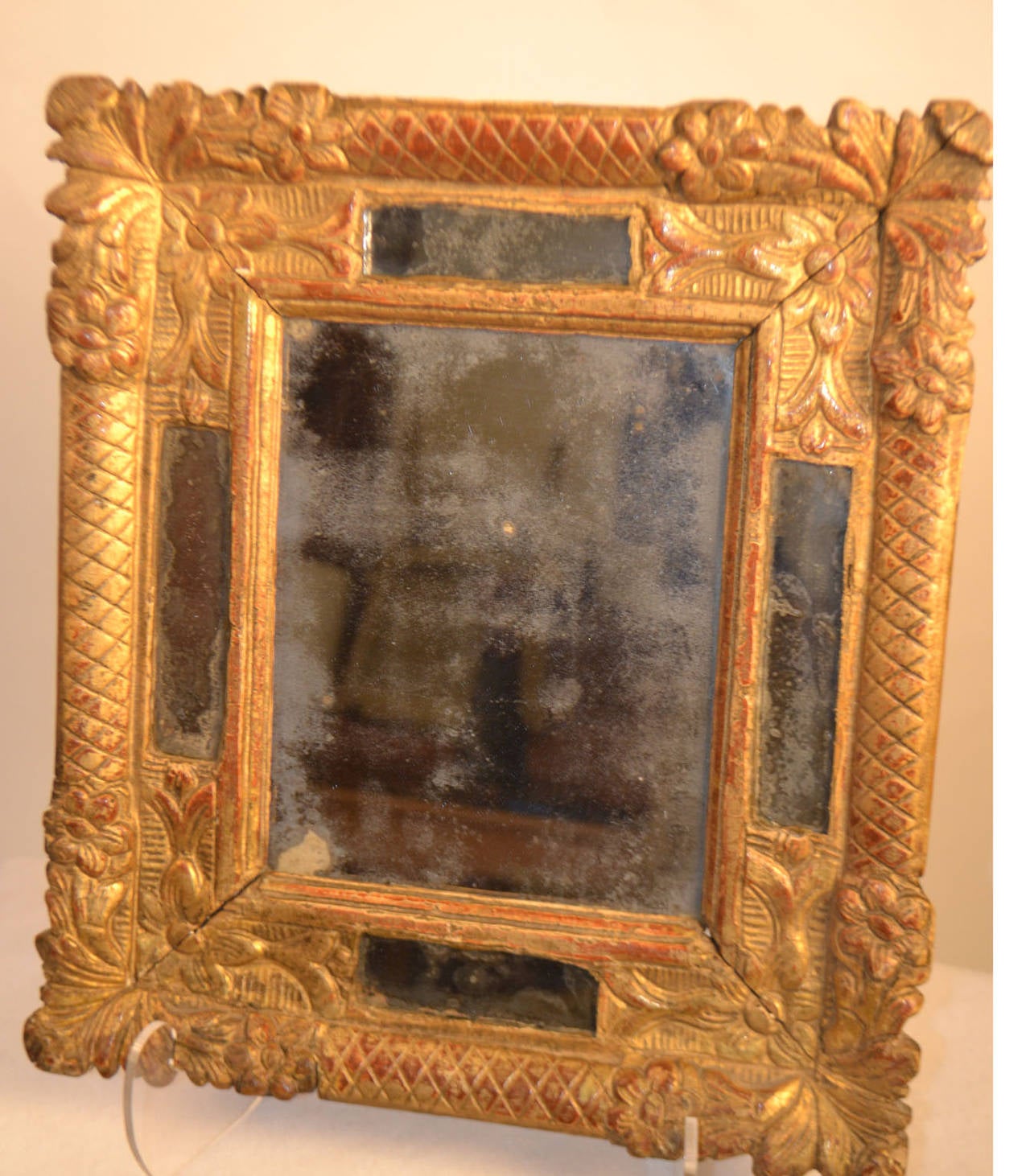 Louis XVI period giltwood mirror, circa 1690.