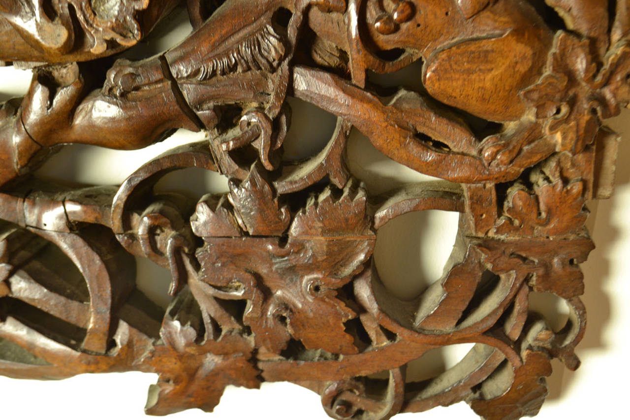 Mirror with elaborately carved reticulated wooden frame, circa 1880.