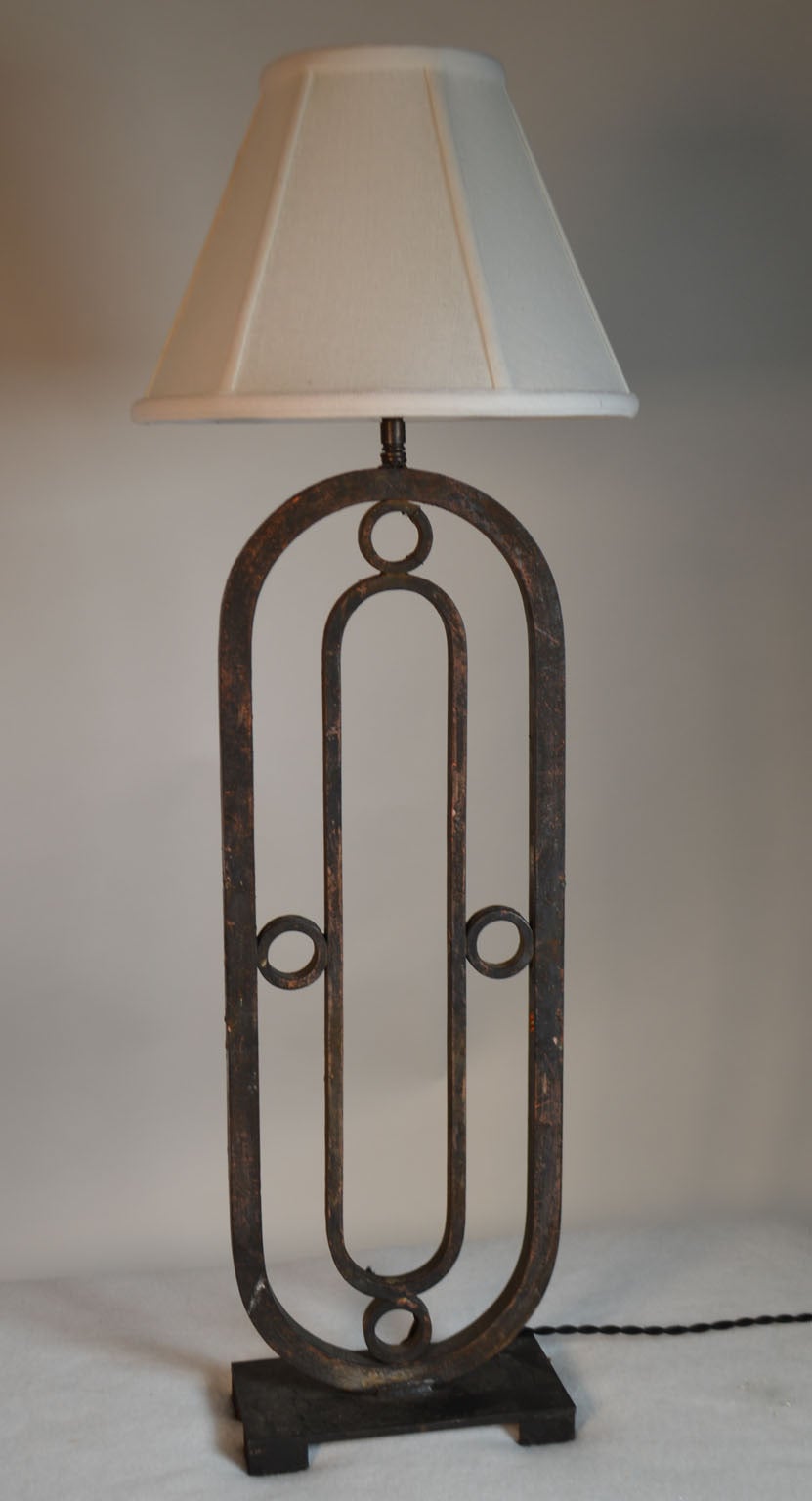 Pair of wrought iron lamps made from old grates, circa 1890. Rewired, three-way socket.