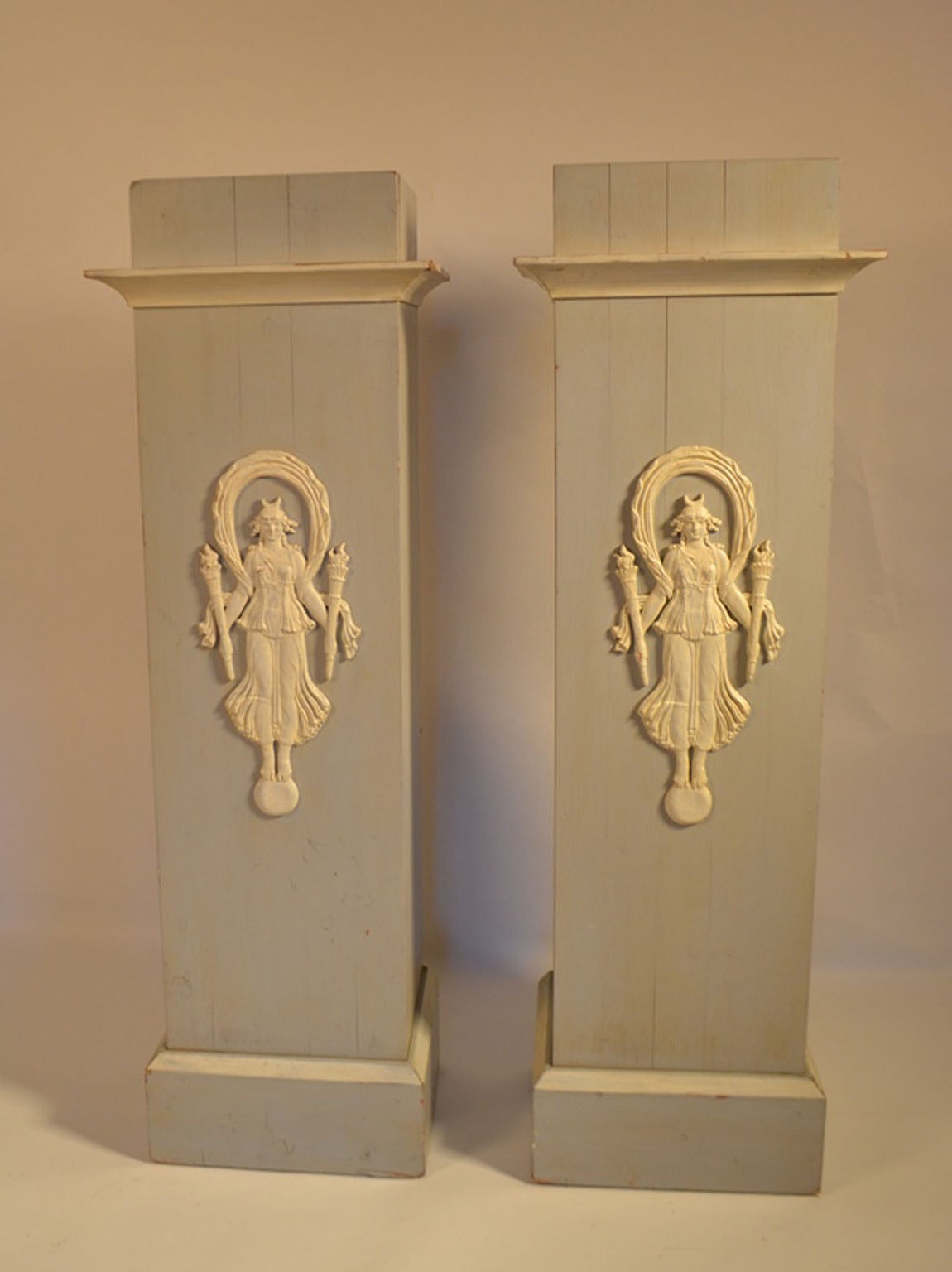Contemporary pair of Decorative French Pedestals with carved Indochine figures holding torches.