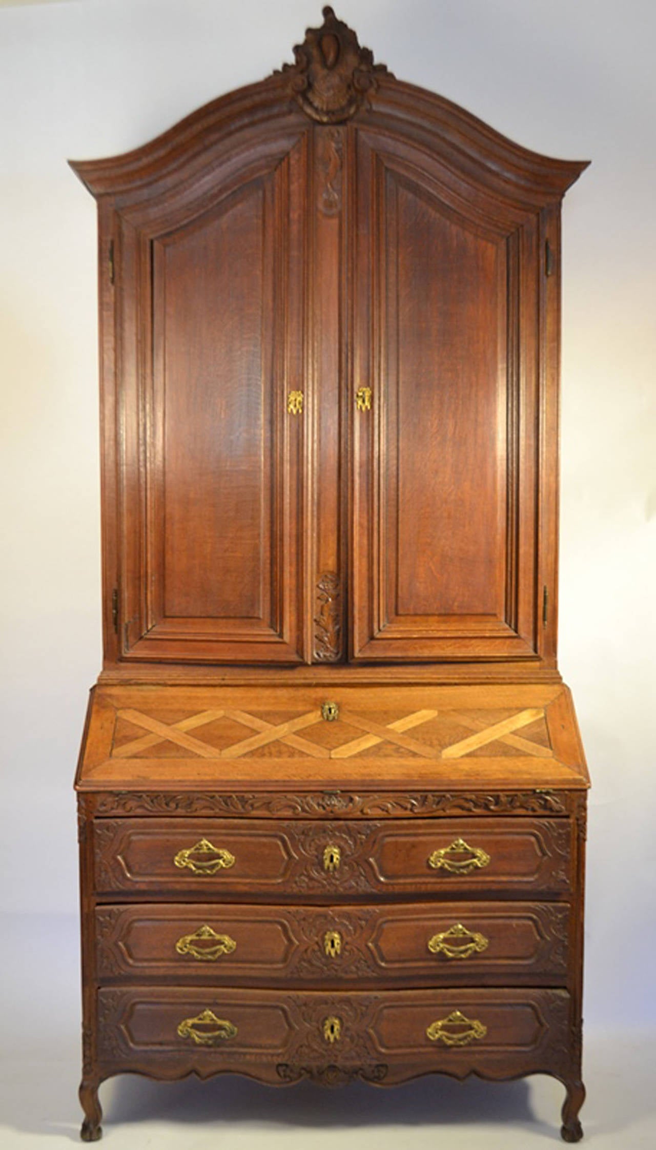 Stunning tall oak secretair on top, beautifully carved drawers resting on paw feet.