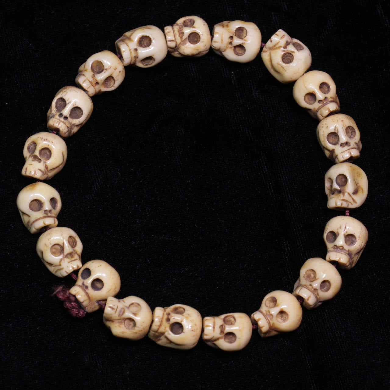 This 18th Century Tibetan rosary (mala) is made up of 19 carved beads of bone (including the head bead) each of which bears the likeness of a human skull. This rosary would be used in certain tantric rituals and help remind one of the impermanence