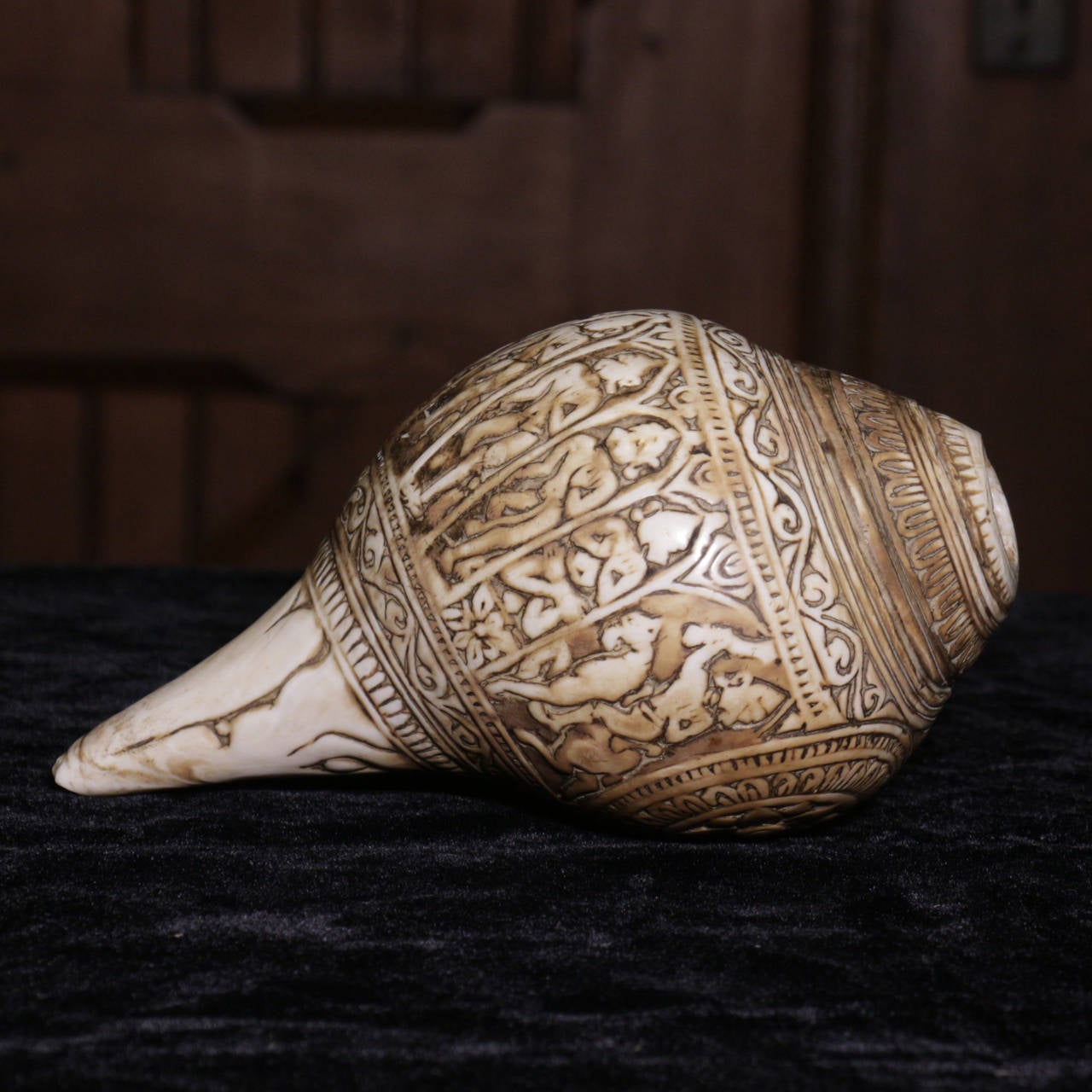 This conch shell is carved with various incarnations of the Hindu deity Vishnu including Narasimha. It dates from the India Pala dynasty circa 11th century.  In Asia, Conch shells have long been used as instruments in religious rituals. By blowing