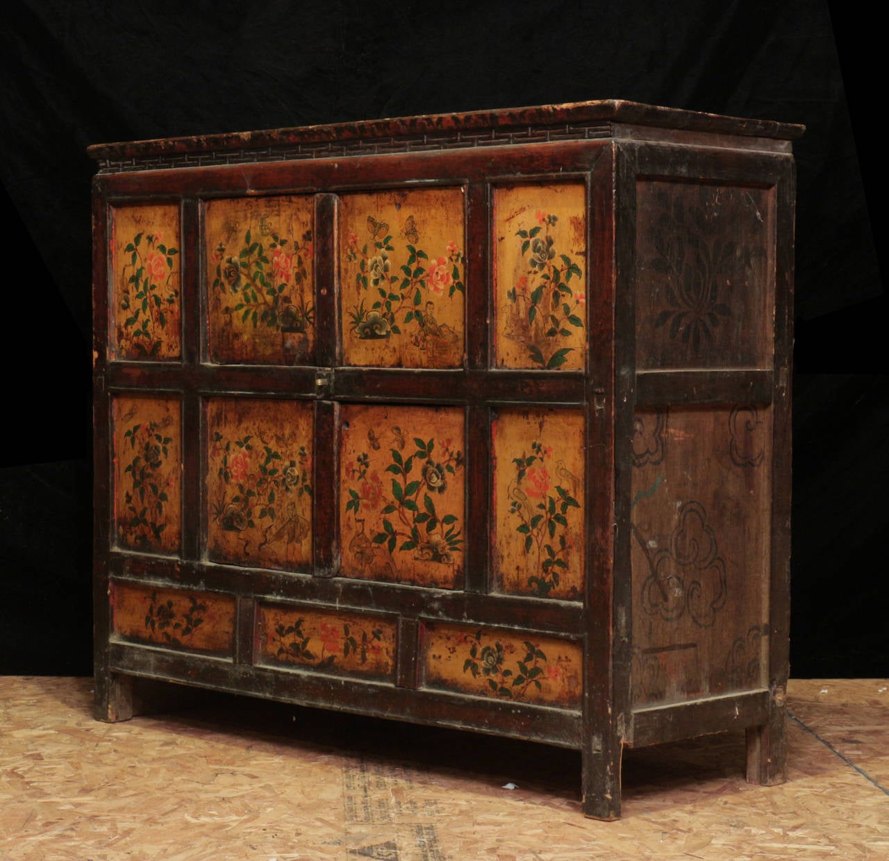 Excellent example of a real antique Tibetan cabinet from an aristocratic estate in Lhasa, Tibet. Note the fine brush work of the butterflies.