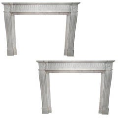 A pair of Louis XVI Style Carrara Marble Fireplace Surround,