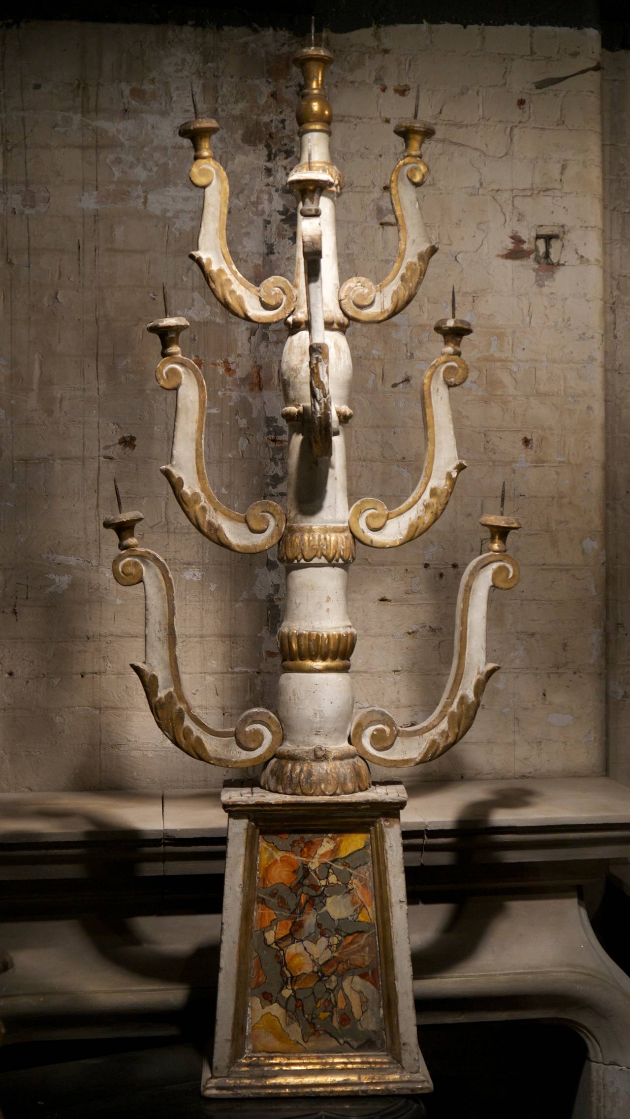 A beautiful pair of Italian 17th century painted wooden church candelabrum.