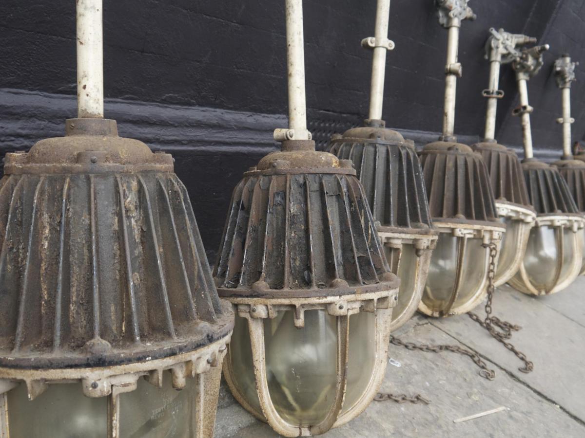 A set of 12 1950s Industrial lights from the north of England. Can be sold separately.