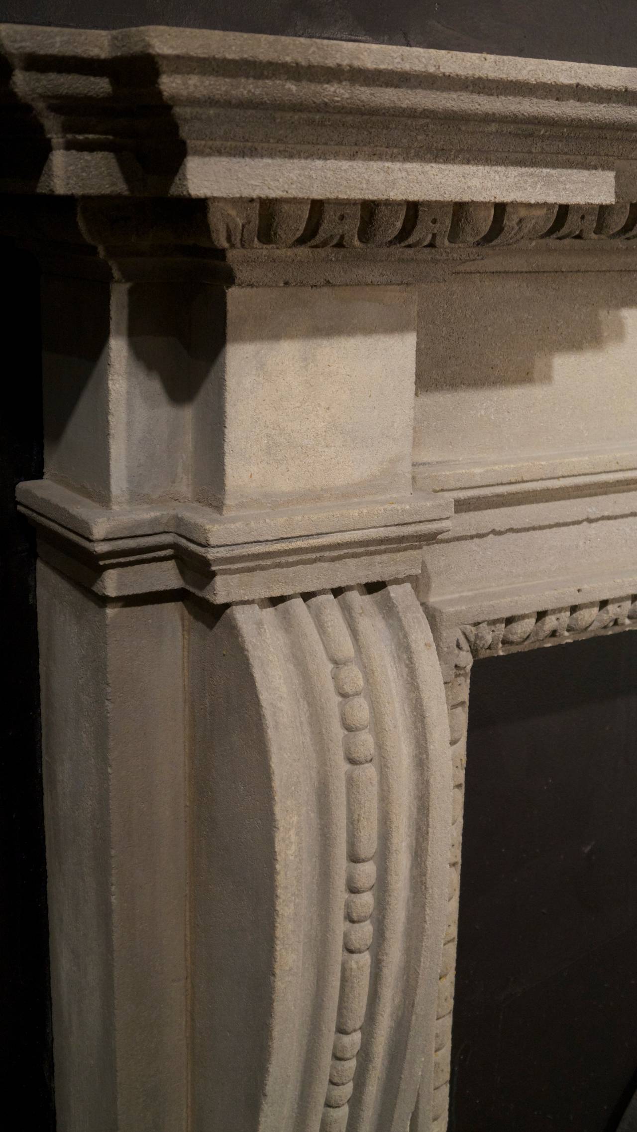 English bath stone surrounded with a plain center tablet and bowed carved legs ending in delicate anthemion.