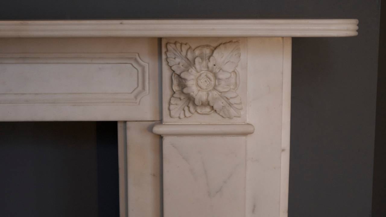 An original Georgian marble surround with beautifully carved corner blocks and centre plaque and with a birds beak shelf. Includes original Georgian hob grate but can be sold separately. Regent Park/London.