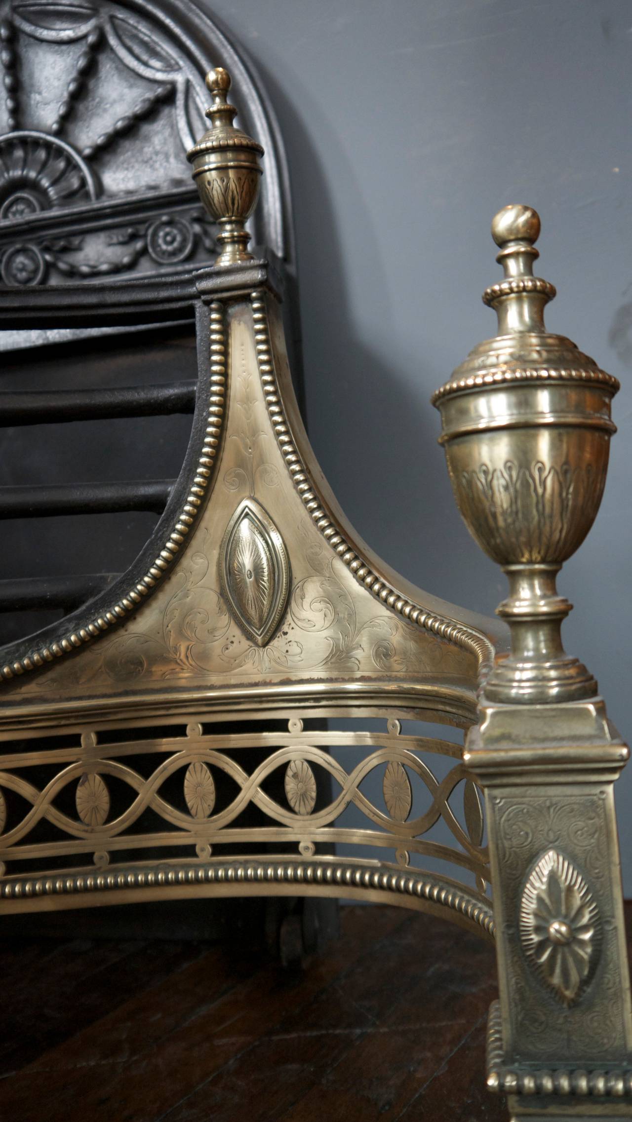 A huge antique Thomas Elsley of London fire basket fireplace in cast iron and serpentine brass fret.