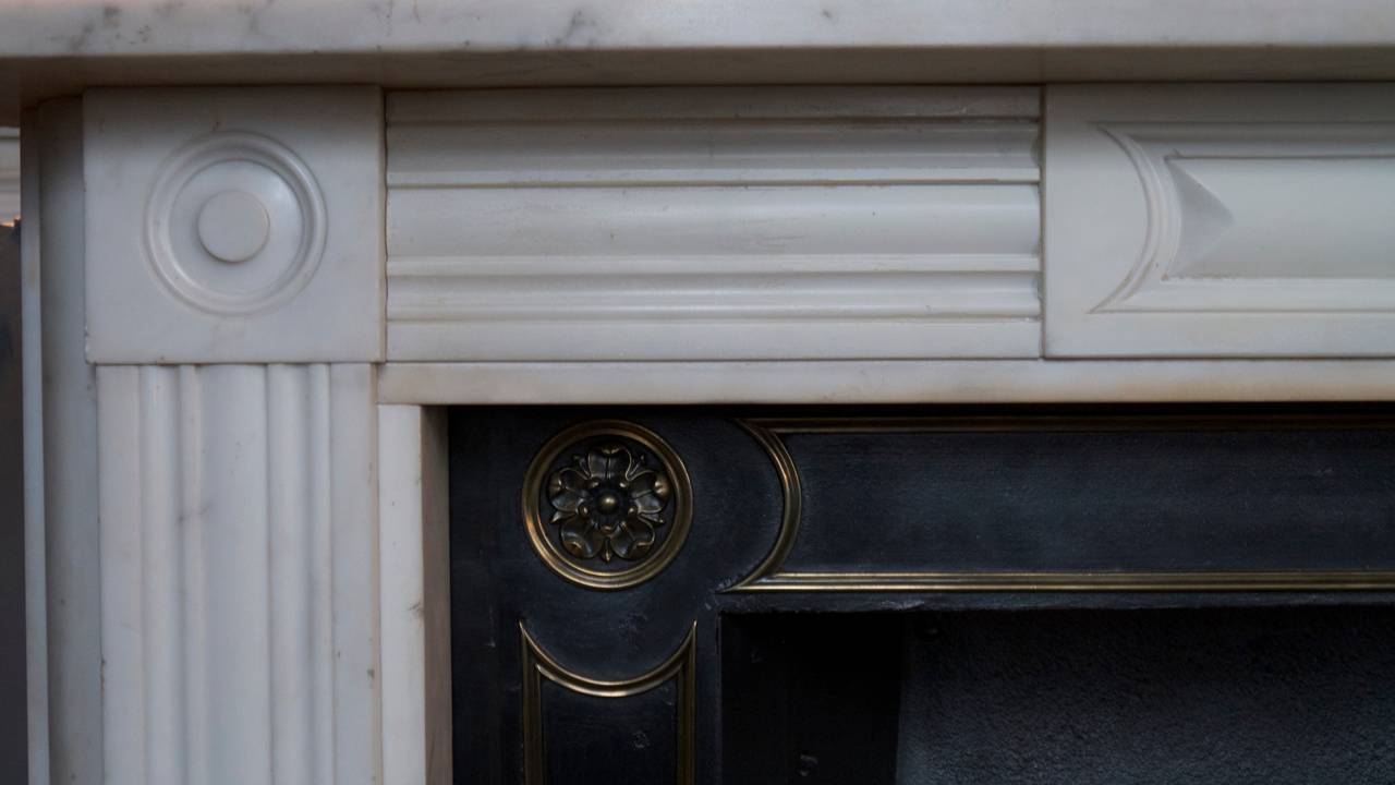 Antique Statuary white Georgian marble fireplace with a lovely centre plaque.
