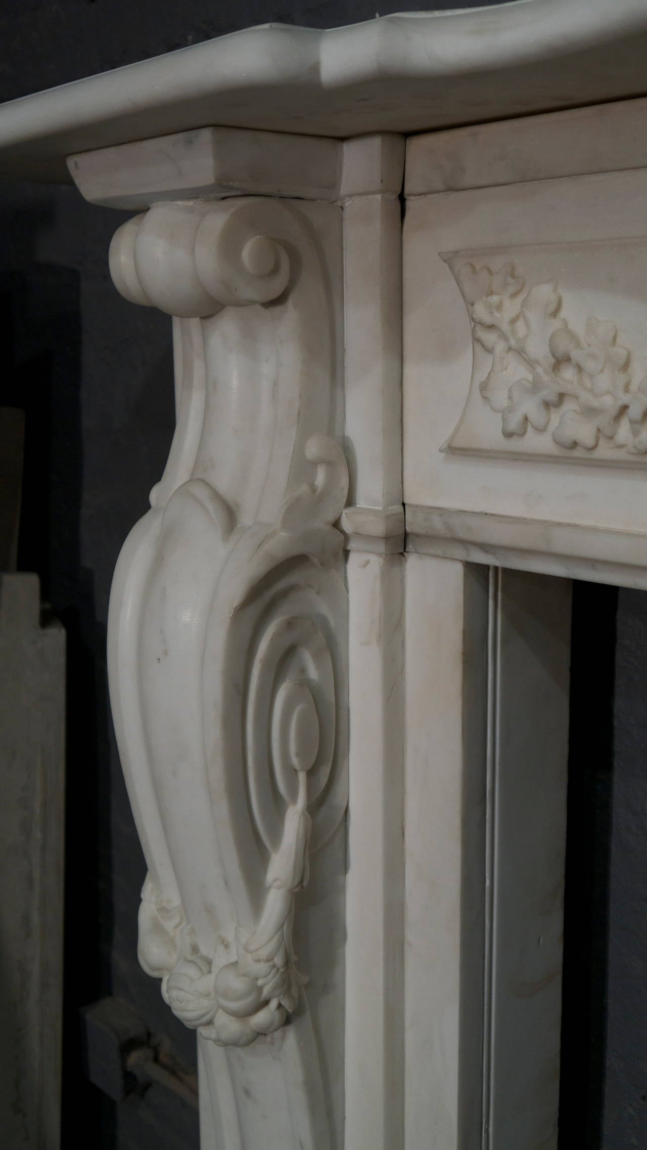 A unique Victorian statuary white marble surround with bowed legs and a serpentine shelf. A lovely piece, circa 1850-1870. Oxford Gardens, London.