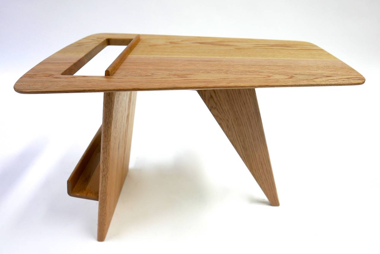 Oak occasional table by Jens Risom. Offered by his company Jens Risom designs Inc. in 1949. This early design is considered one of the designers best.  This example comes from the original owner and has been beautifully refinished.