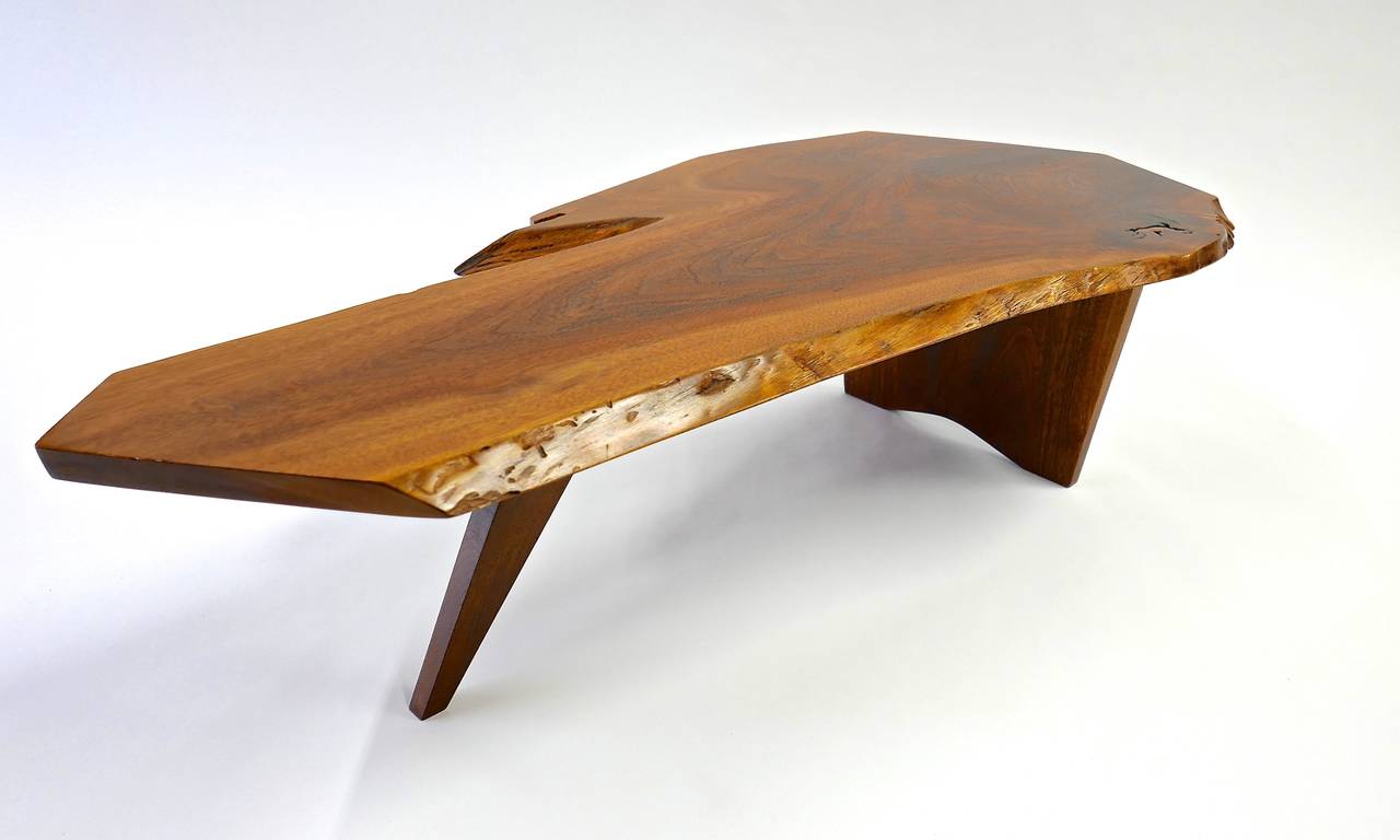 A slab coffee table made by George Nakashima in 1972.
The table is signed with the clients name to the underside.
Sold with a letter of authentication from Mira Nakashima and a copy of the order card.