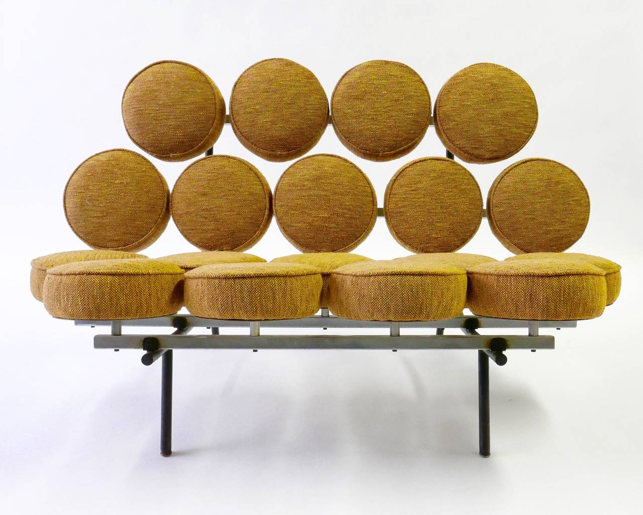 This is a fine example of an iconic 20th century design.
Created by George Nelson for Herman Miller in 1956.
This original marshmallow sofa has butterscotch wool fabric over chrom-plated and enameled steel. The manufactures label is present to