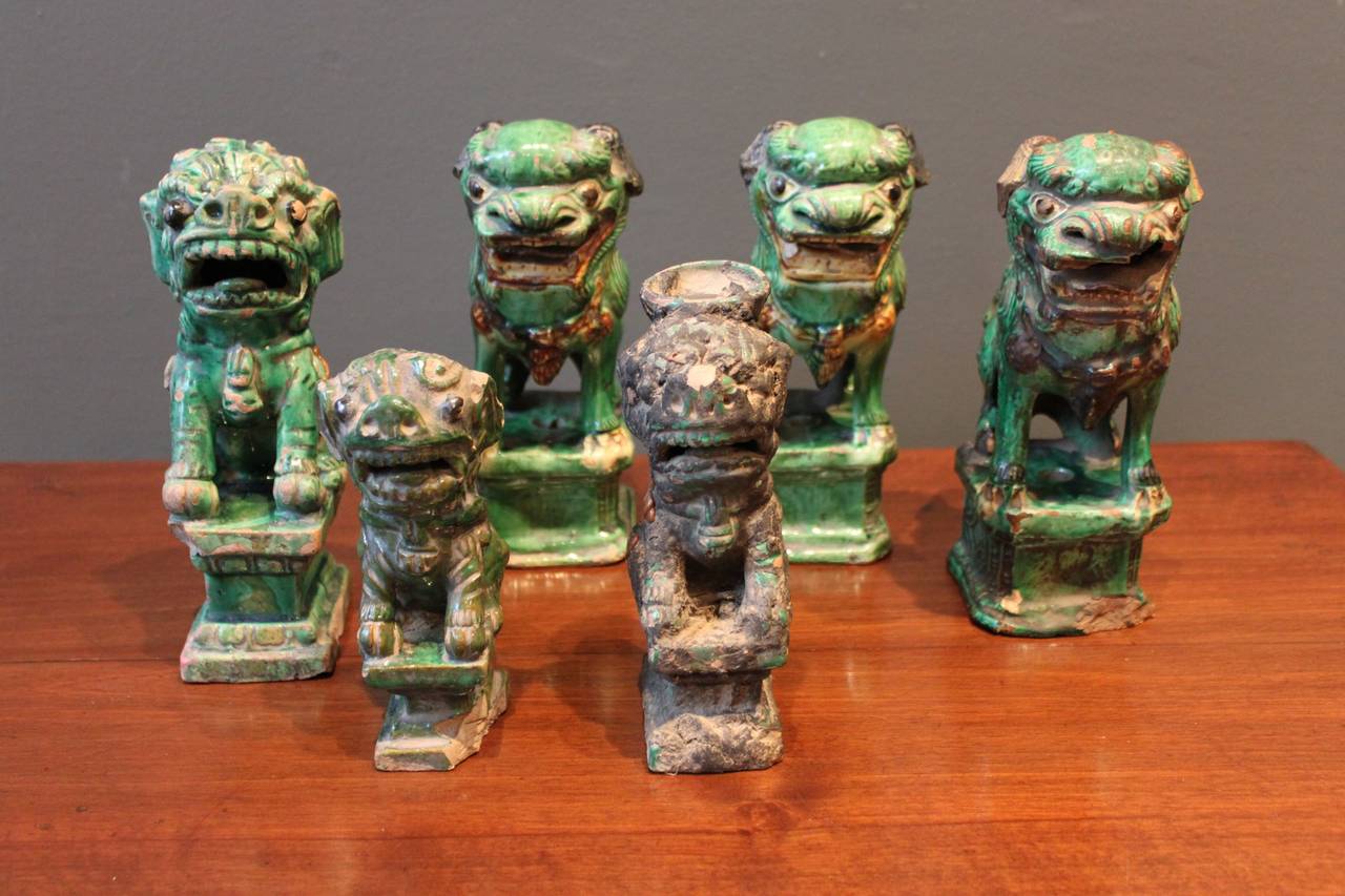 Collection of Chinese terra cotta green glazed foo dogs.  (6)

Smallest: 5 1/2 high x 2 d x 1.75 wide
Tallest:   9 x 5 x 3