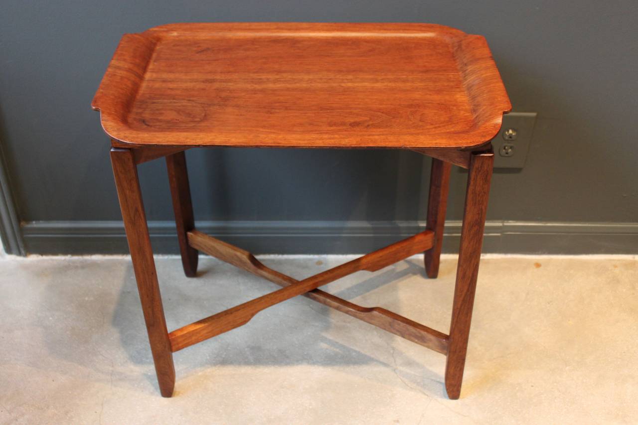 Teak tray table with collapsible base recently refinished.  Scandinavia, circa 1960.