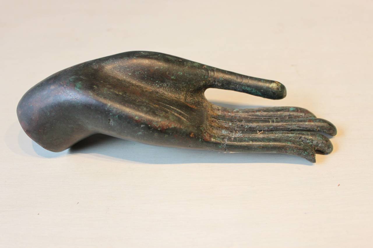 Lovely and elegant Asian bronze sculpture of a Buddha hand, 19th century or earlier.