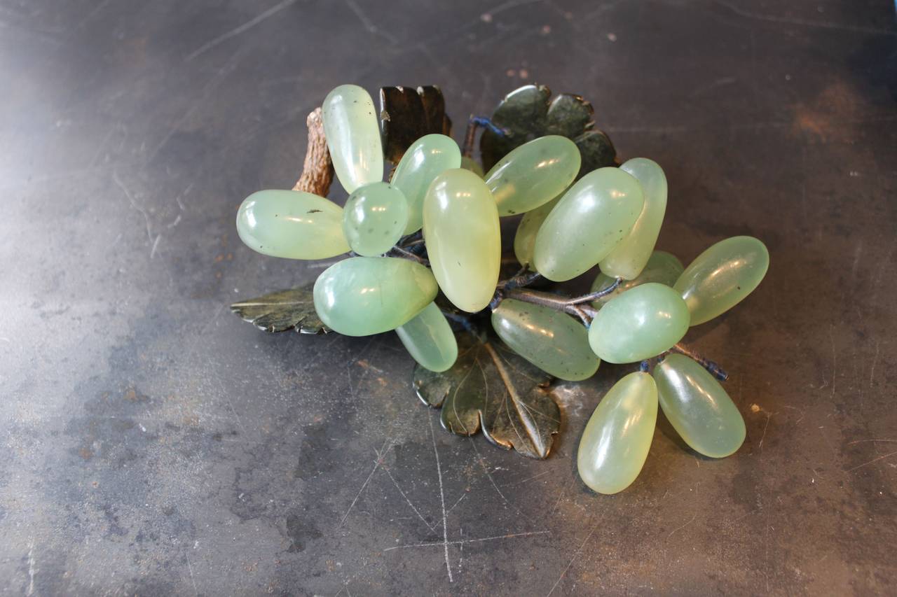 Collection of four (4) jade grapes with wood stems, China, 20th century.