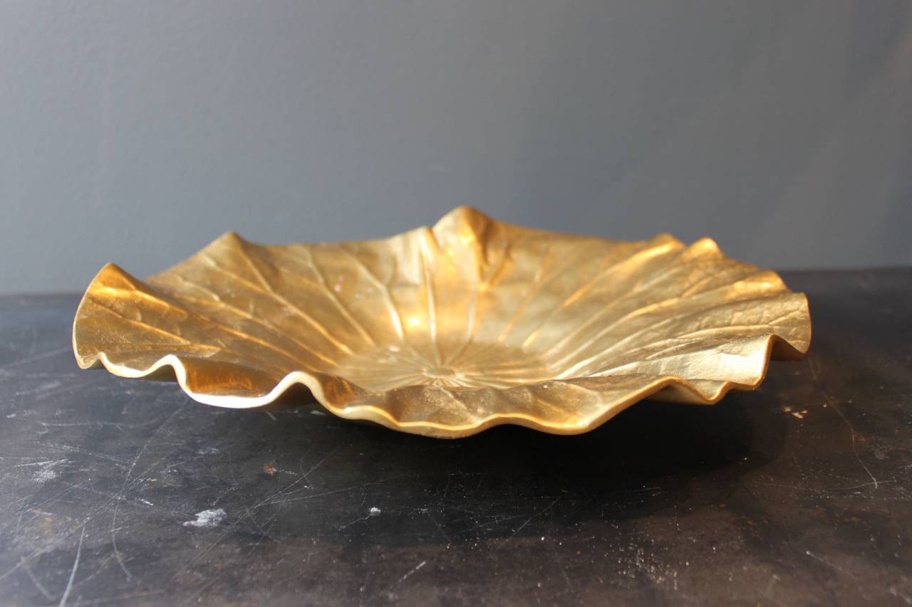 Artfully detailed brass bowl in the form of lotus leaf.