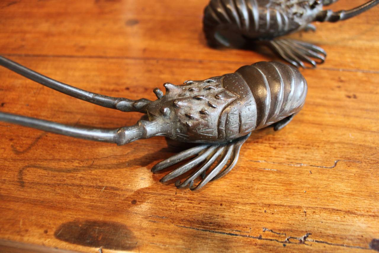Charming pair of Japanese lobster with antennae. Chopmark signature to underside.