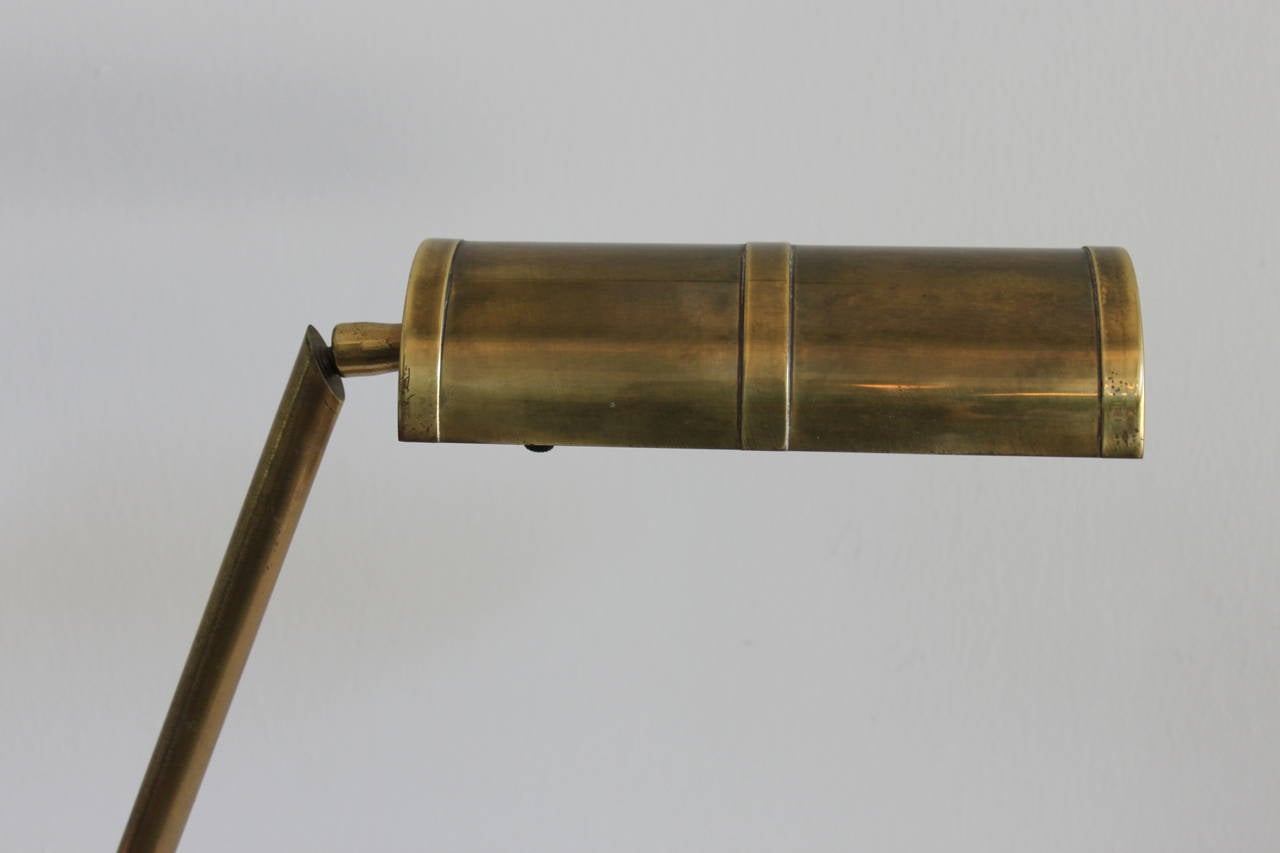 Vintage Frederick Cooper brass desk lamp with adjustable arm.
The lamp has been re-wired and retains its original maker's tag.
