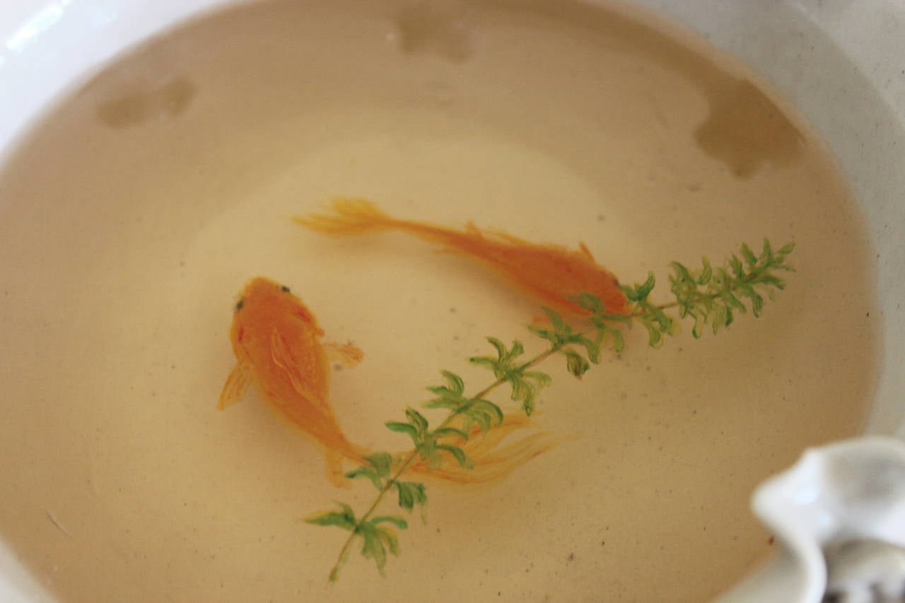 Three dimensional painting of two miniature koi or goldfish 