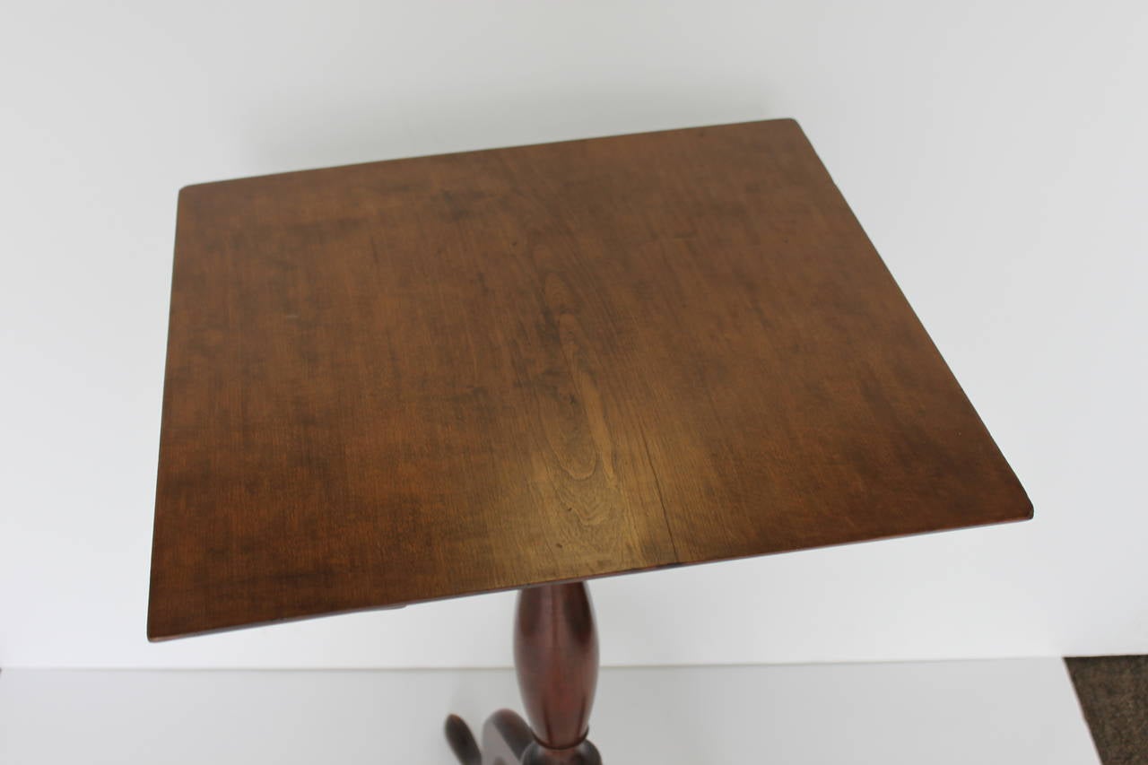 Early 19th century square tilt top table.