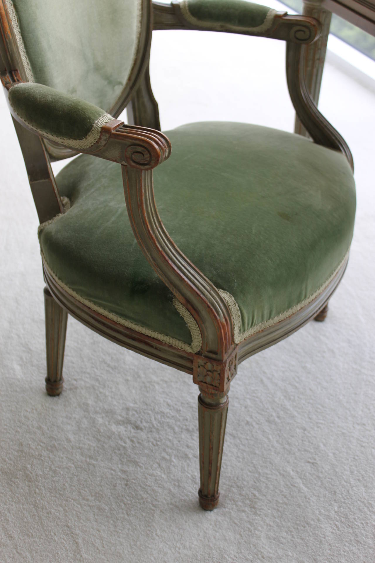 Louis XVI fauteiul chair circa early 20th century in original upholstery and original painted finish.