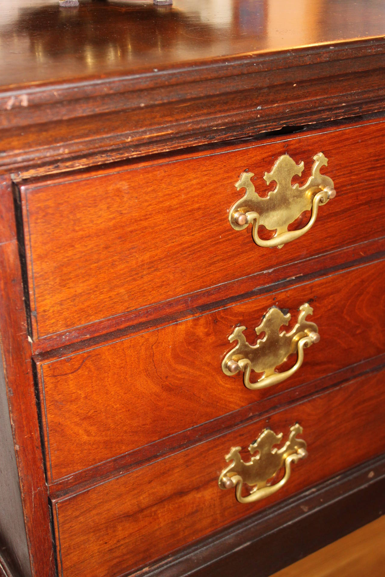 Charming chest on Stand with gently curved legs, original brasses and in good original antique condition.