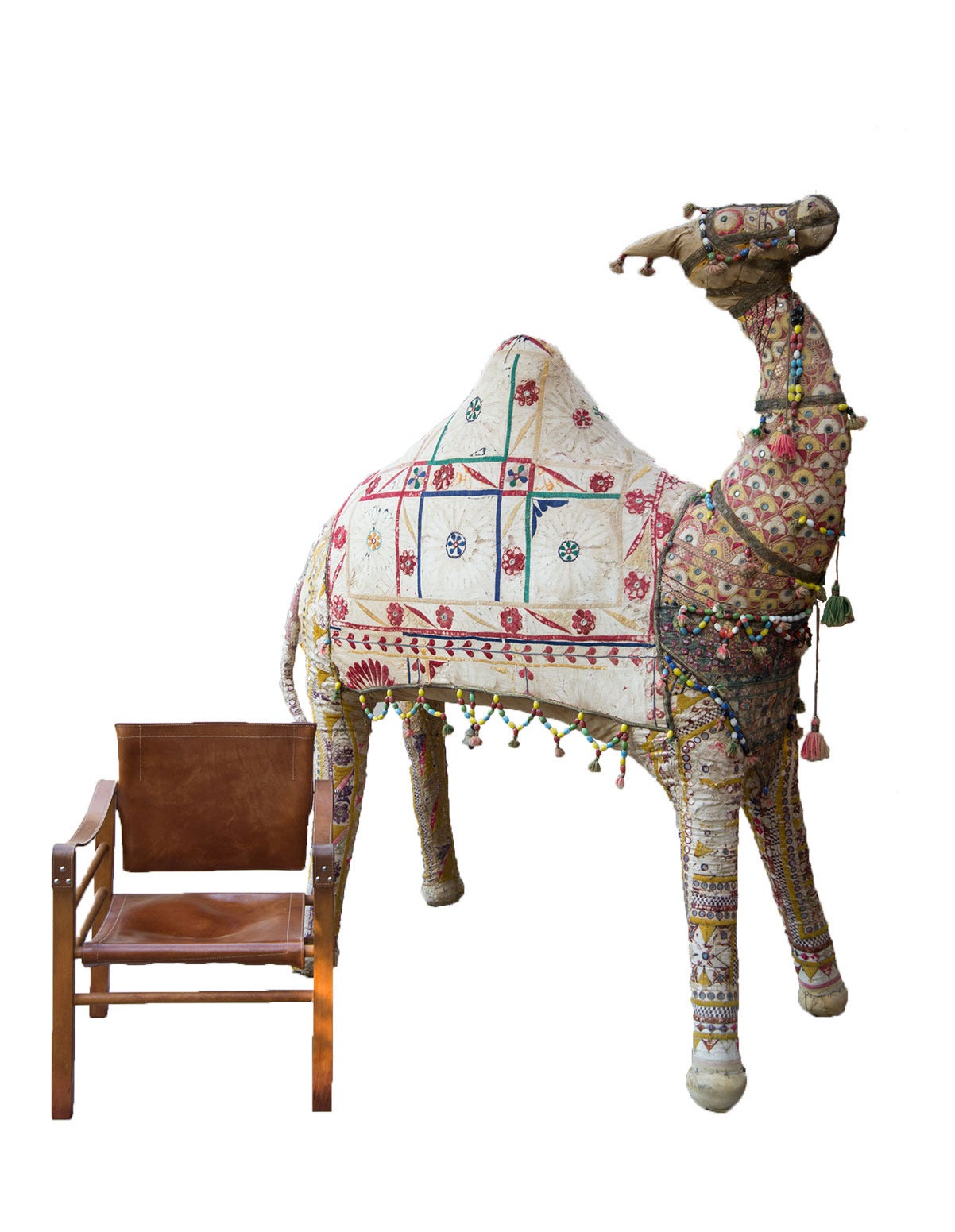 This exceptionally large tapestry camel is artfully adorned with colorful glass beads and detailed embroidery with mirror tiles. The distressed nature of the fabric adds to the charm of this near lifesize dromedary camel.