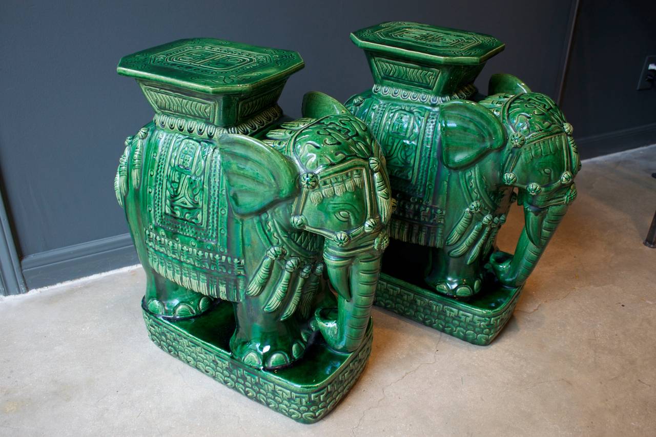 Pair of Mid-Century elephant garden stools or tables in a beautiful emerald green ceramic glaze. These vintage stools are charming and very detailed. They would work equally well indoors or outdoors.