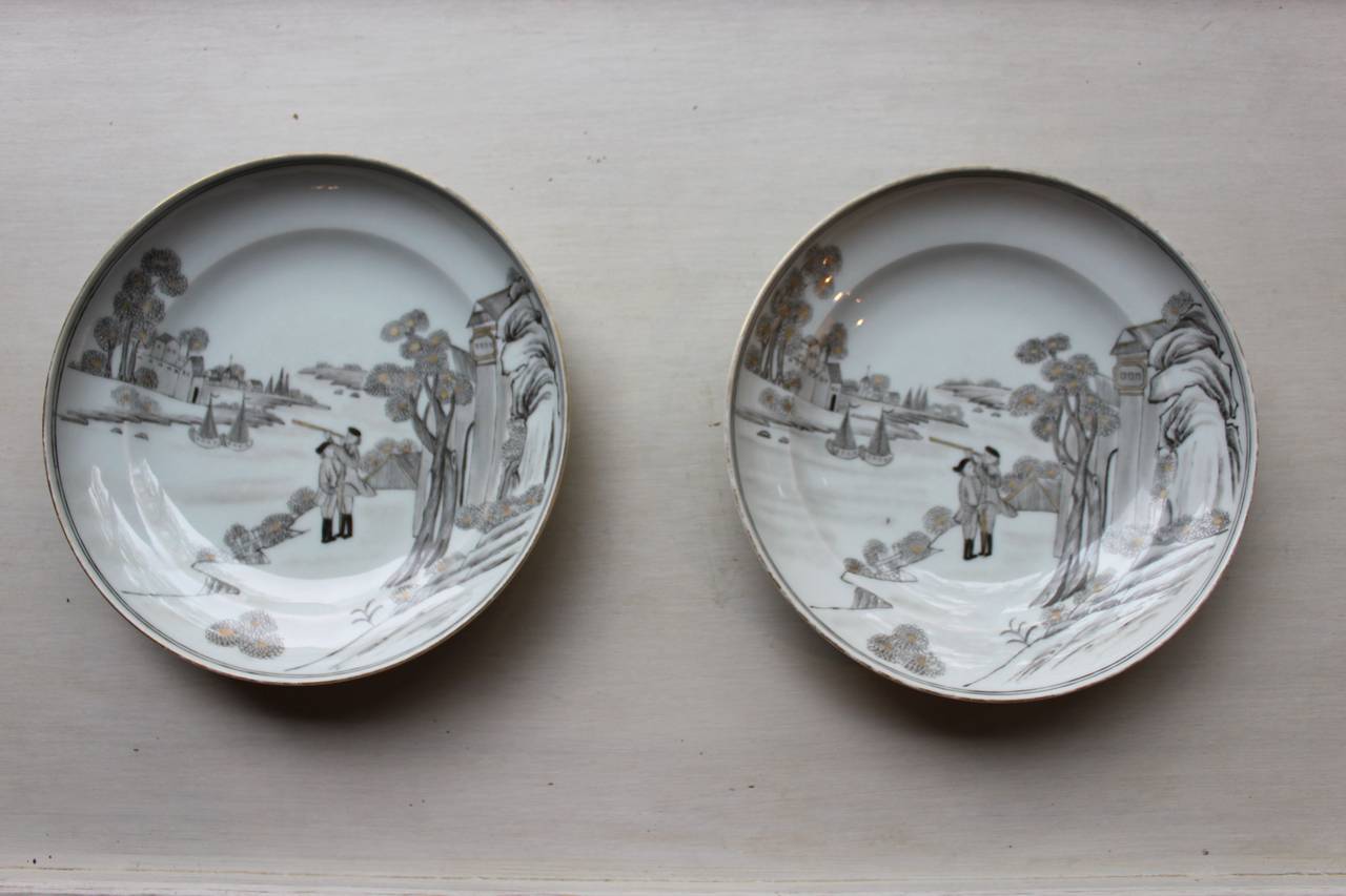 Pair of beautifully executed Chinese exports Grisaille plates with hand-painted scenes. Created for the European market in the 19th century or earlier.

This highly decorative pair of plates are in soft gray tones and are finely detailed each