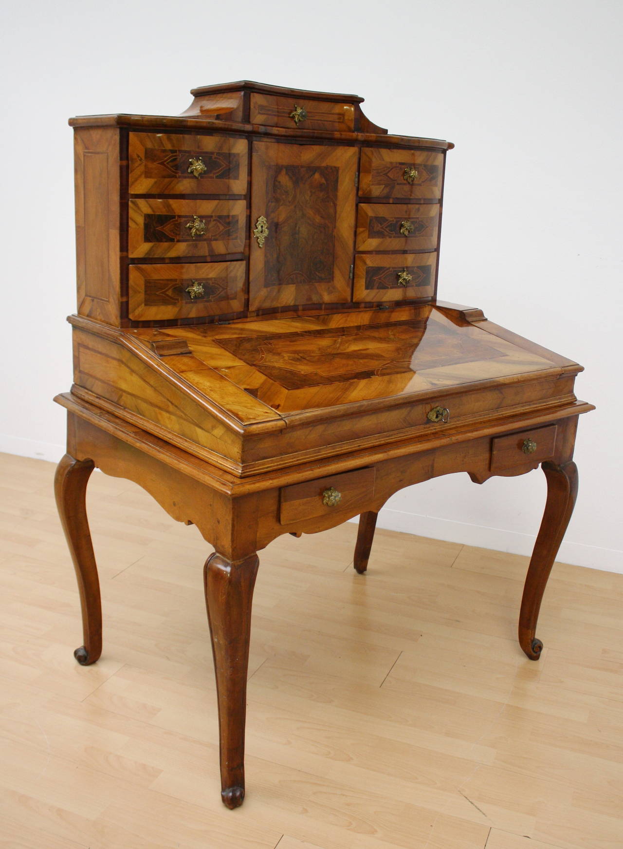 Charming small desk on high legs with hinging cover and tabernacle cabinet.
Typical Austrian Maria Theresa Baroque.