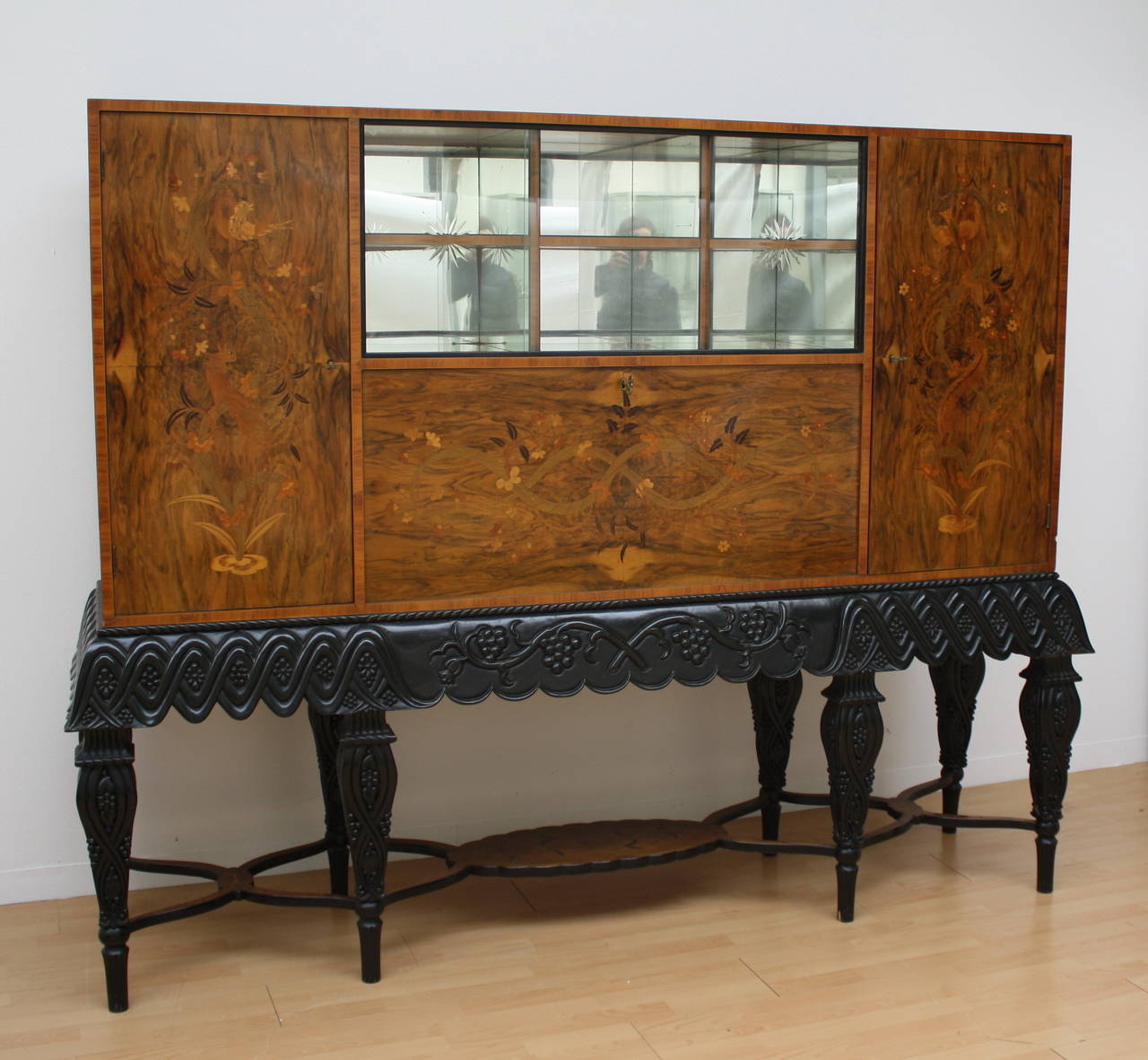 Typical Art Deco Dry Bar Cabinet. Cabinet walnut veneer with inlaid doors on carved ebonized aight feet Consol. Austria, Vienna 1920 / 1925.