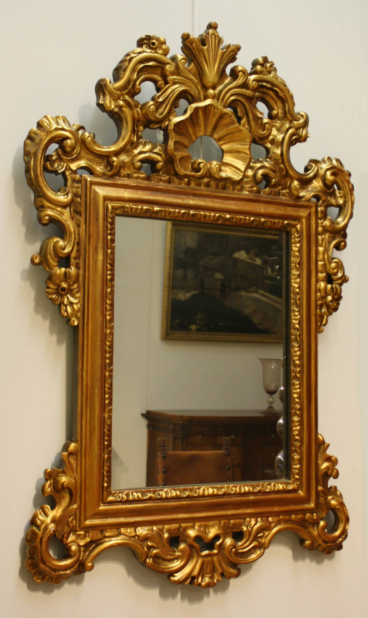 Baroque giltwood carved mirror frame.