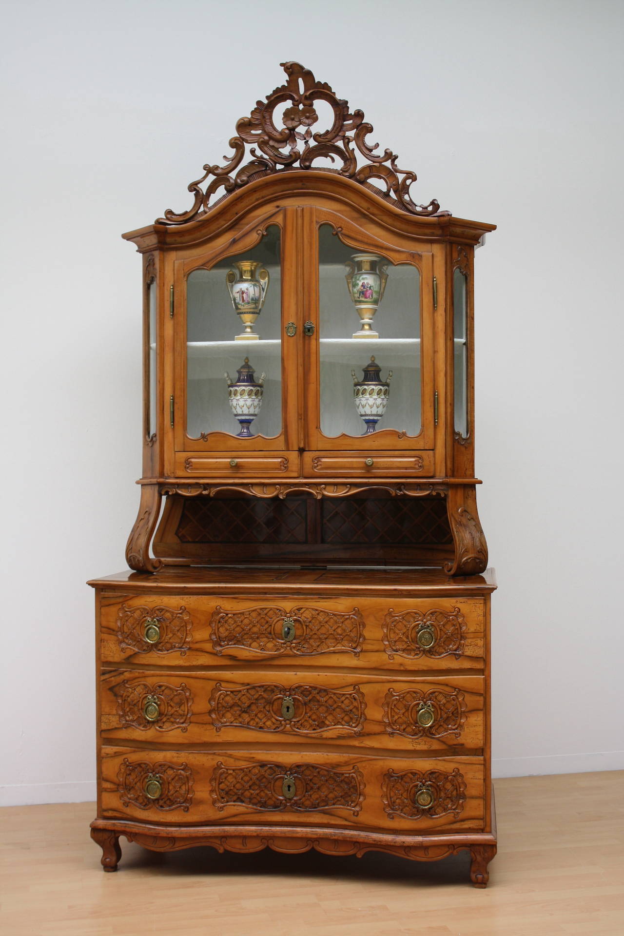 Rare "Salzburger bone Baroque" cabinet with front carved three-drawer commode and vitrine on top, rich carved "Supraporte."