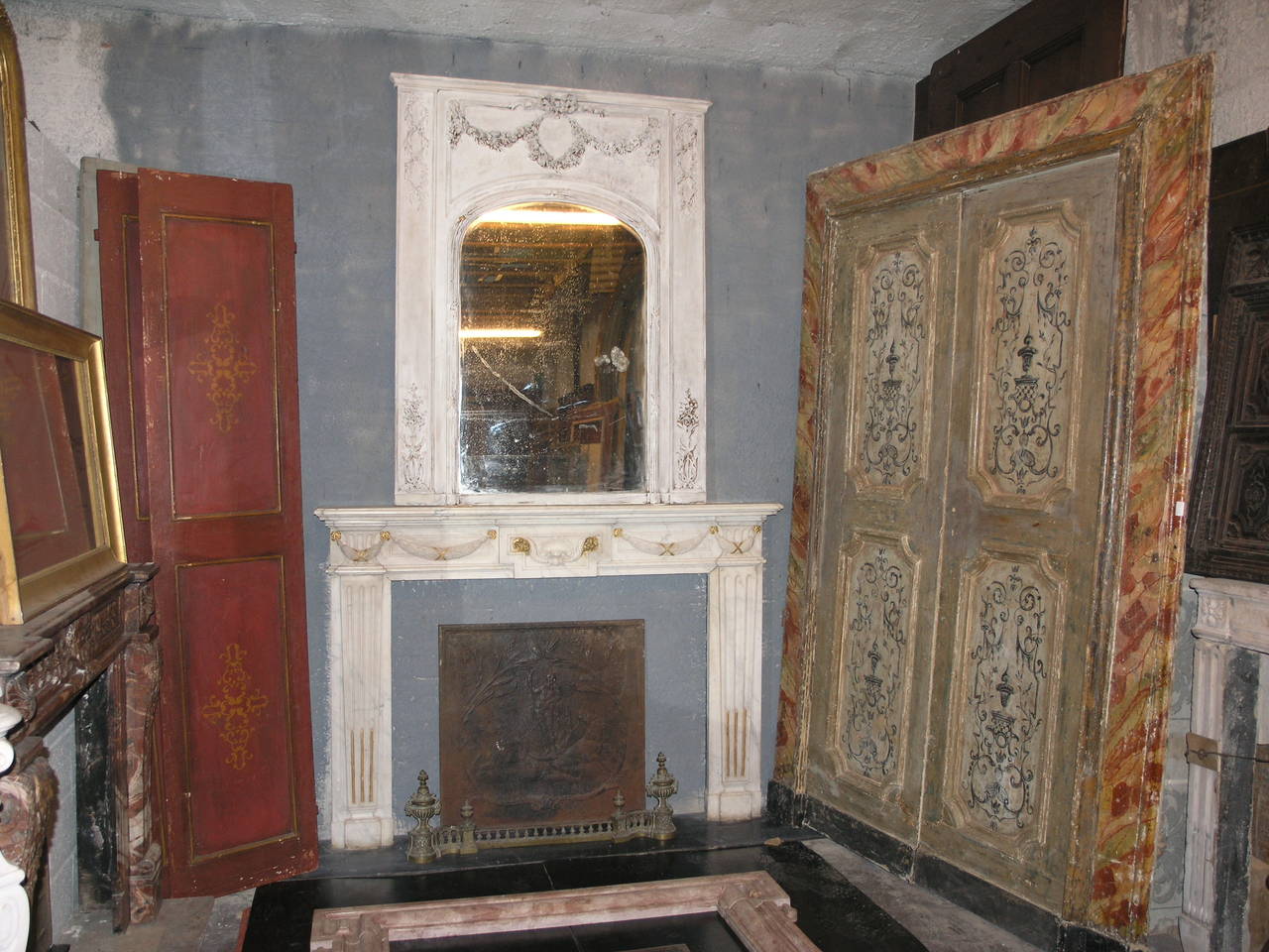 Antique Fireplace made of Carrara's Marble with golden 
Comes from Genova, Italy